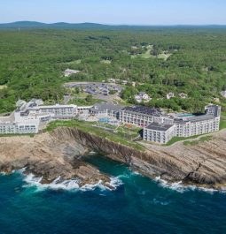 hotel on a cliiff's edge overlooking the ocean in maine