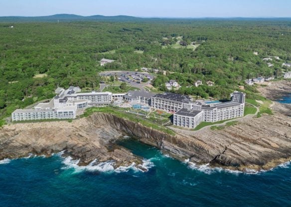 hotel on a cliiff's edge overlooking the ocean in maine