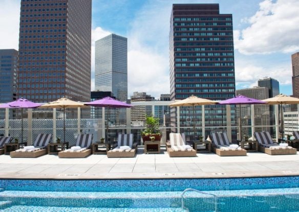 rooftop pool with loungers set amidst the denver cityscape