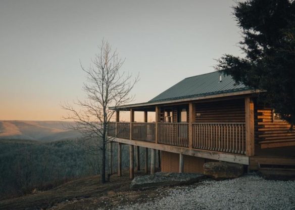 cabin with large deck at sunrise