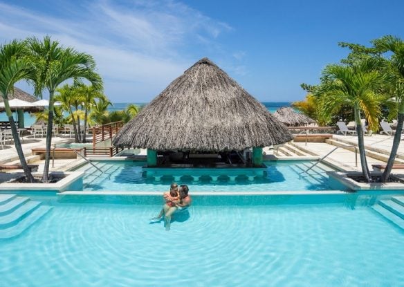 massive resort pool with swim up bar