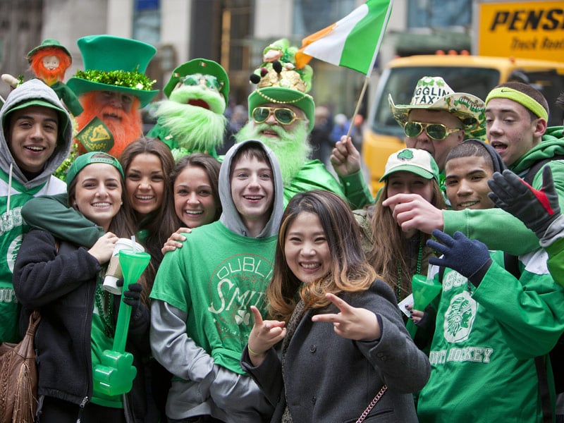 group of parade attendees in green
