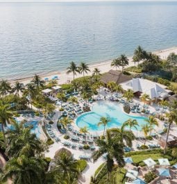 aerial view of beachfront resort pool complex