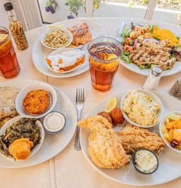 table with multiple plates of southern food