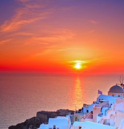 stunning sunset over the Aegean with whitewashed buildings