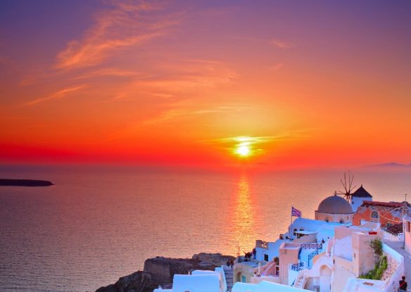 stunning sunset over the Aegean with whitewashed buildings