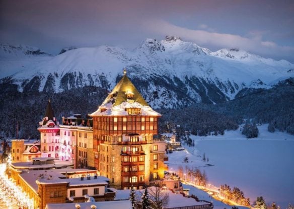 Grand hotel in middle of snow-covered mountains