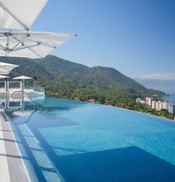 outdoor pool overlooking the ocean at a cliffside resort