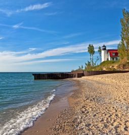 Point Betsie lighthouse against beach and water