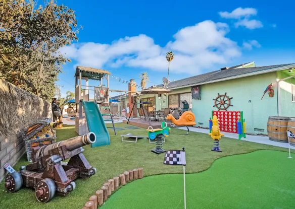 outdoor play area with pool and toys