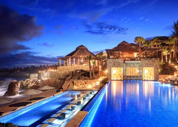 The pool at night at Esperanza Resort in Los Cabos