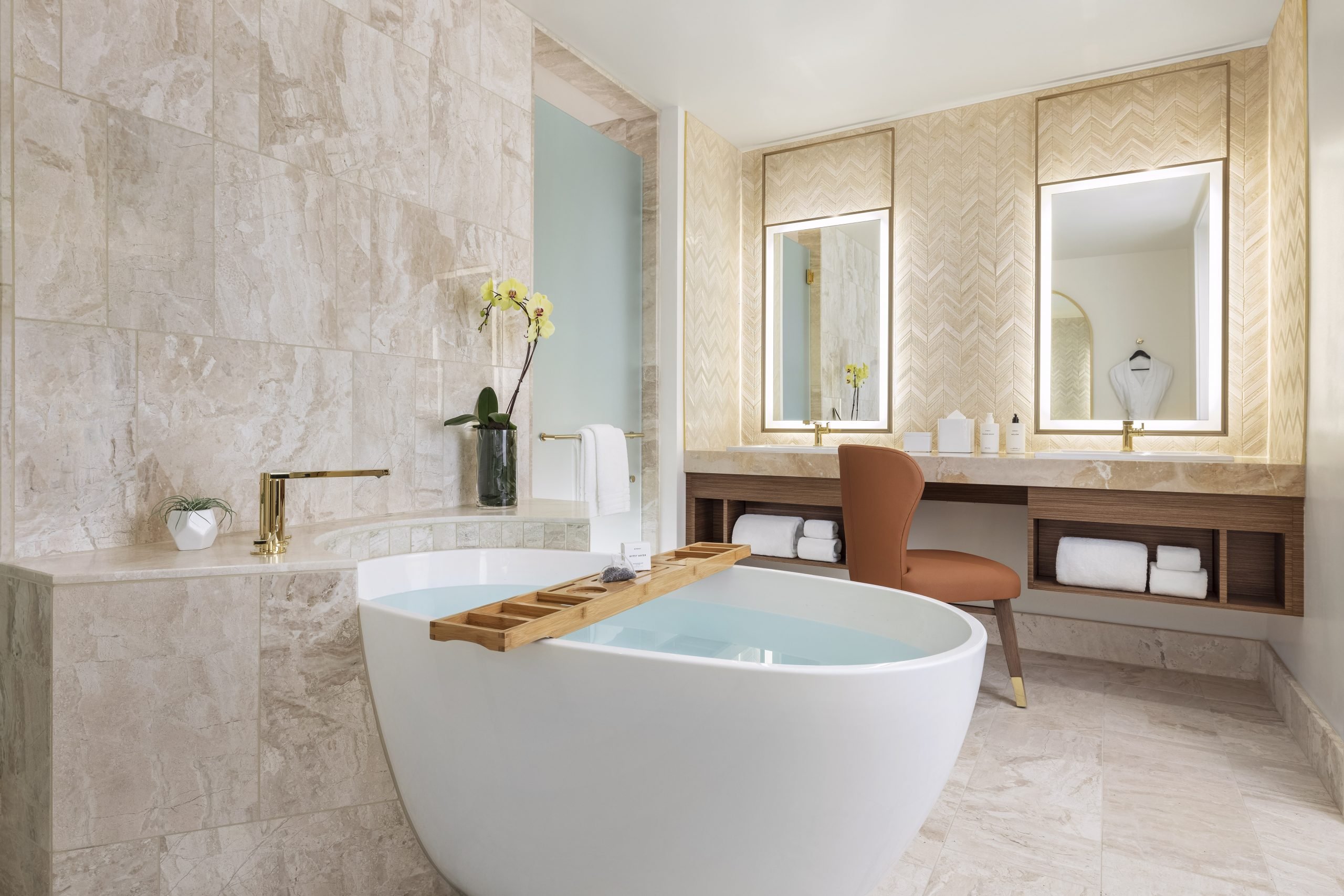 Deep soaking tub and luxurious amenities in a guest bathroom at Resorts World Las Vegas