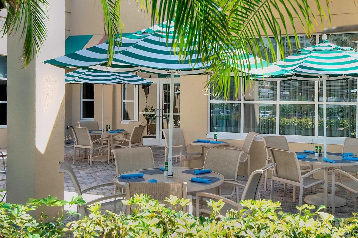 Outdoor tables and chairs with umbrellas for dining