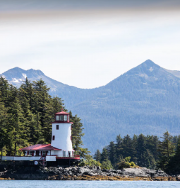 red and white lighthouse on an island in Sitka