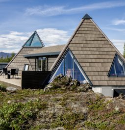Geometric exterior with green grass and blue sky at Iceland Airbnb