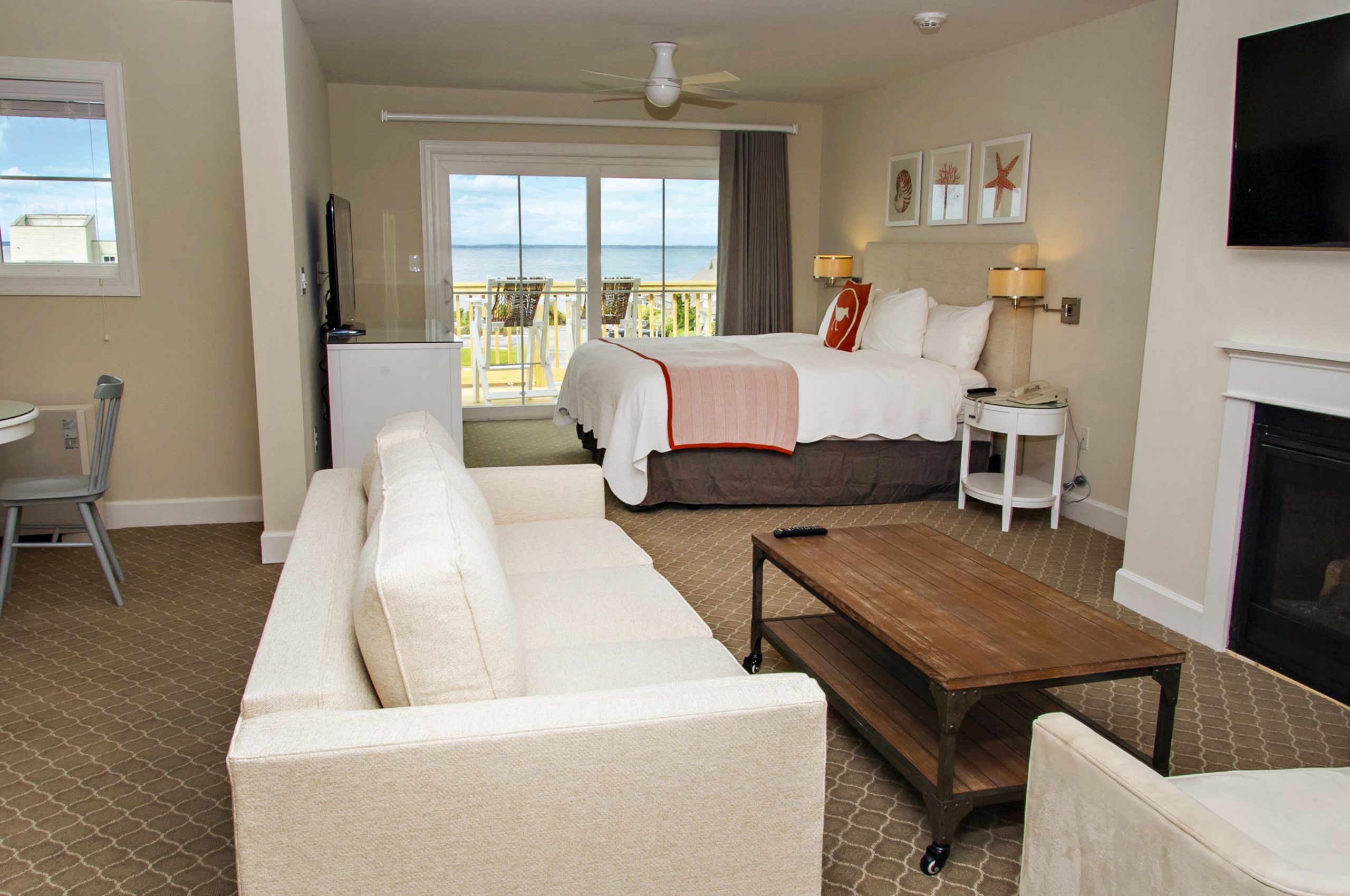 Room interior with couch seating and ocean view