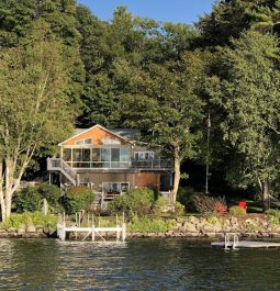 view of the Spectacular Maine Cobbossee Lakefront Home from the lake