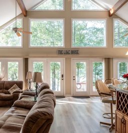 Large windows illuminate a spacious living room