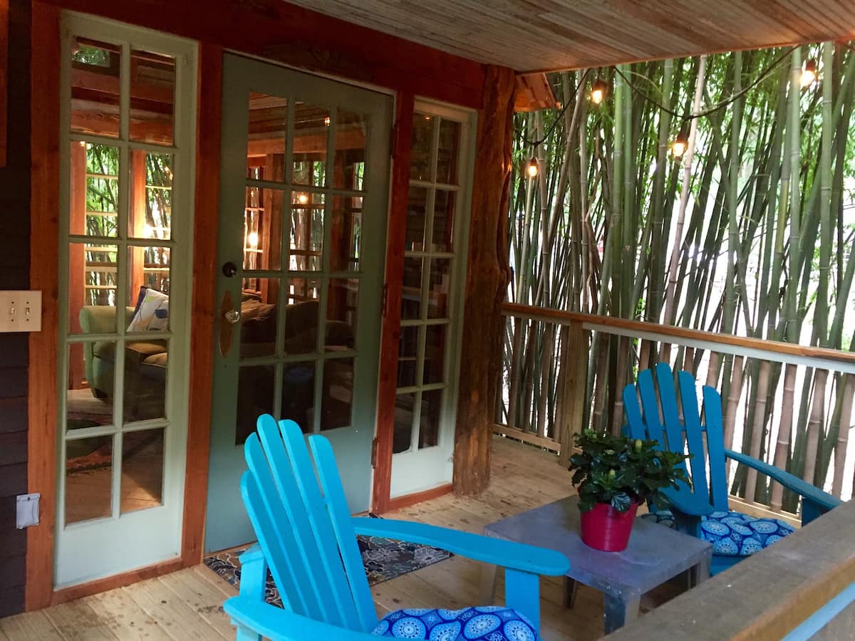 Furnished front porch with bamboo view
