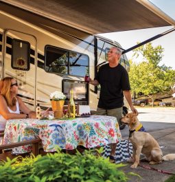 Couple and dog outside RV