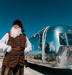 Santa standing next to an Airstream