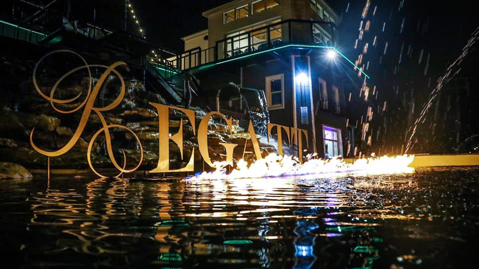Regatta sign lit and in water
