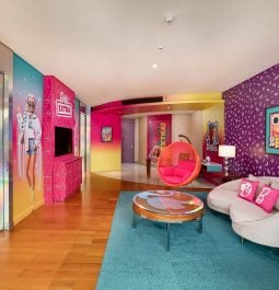 Barbie Suite living room with purple walls and blue carpet