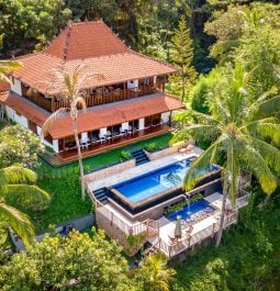 Multi level villa with pool set amongst huge green trees