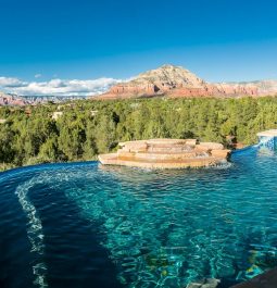 infinity pool with a red rock backdrop