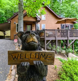 Black bear statue outside cabin