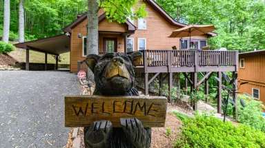 Black bear statue outside cabin