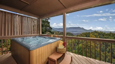 hot tub on deck with views of the valley and mountains