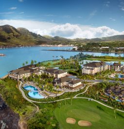 aerial view of oceanfront resort with pools in Kauai