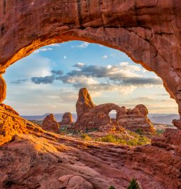 Natural window formed by arch in rocks at Arches National Park