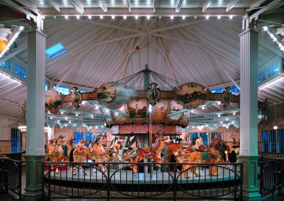 Carousel with painted animals indoors
