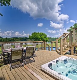 Lake house decking with table and hot tub