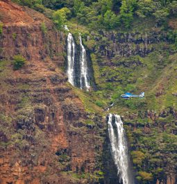 Helicopter in front of waterfall in Waimea Canyon, Kauai