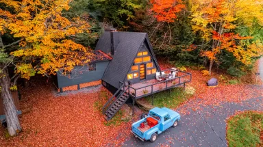 A-frame chalet with fall leaves