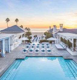 Hotel outdoor pool facing the ocean during sunset