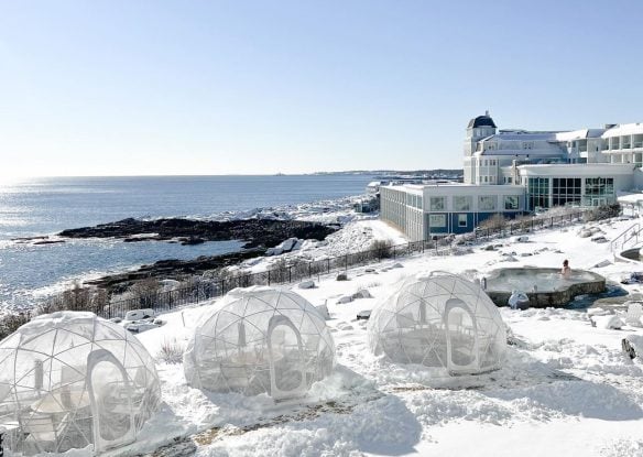 igloo tables with snow overlooking the ocean