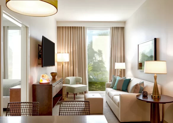 Interior of a hotel suite with a street view