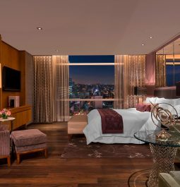 Stylish bedroom with cityscape views