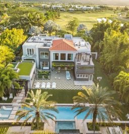 Overview of huge villa surrounded by greenery