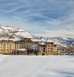 hotel covered in snow with snowmass mountains