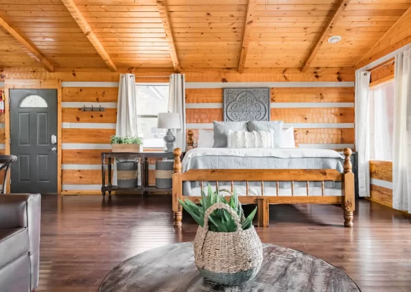 Cabin bedroom with exposed ceiling beams