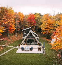 A-frame cabin with fall trees