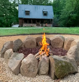 Fire pit by rental cabin