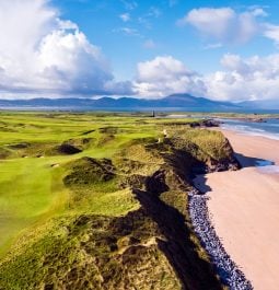 golf course along the Irish coast with a sandy beach