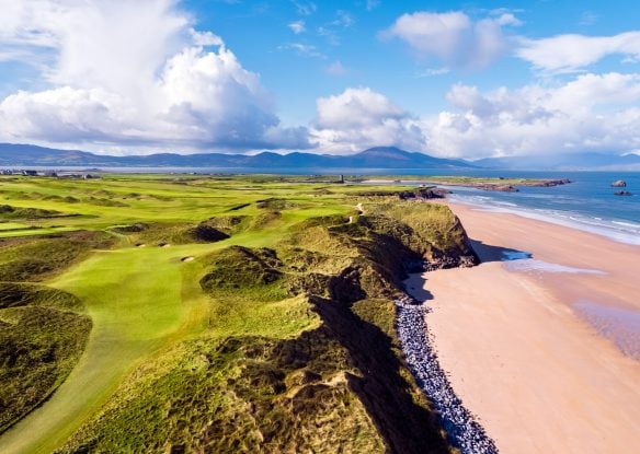 golf course along the Irish coast with a sandy beach