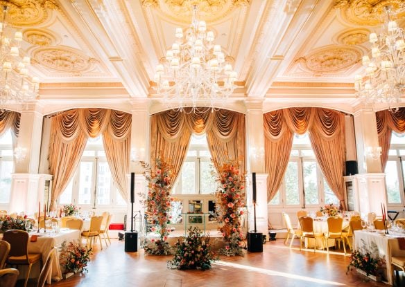 Banquet style room with chandeliers